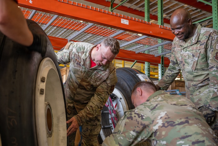 From left, U.S. Air Force Staff Sgt. Dillon Hunick, 96th Bomber Generation Squadron flying crew chief; Staff Sgt. Paul Board, 96th Bomber Generation Squadron crew chief, and Staff Sgt. Natampouloumde Ouedraogo, 2nd Logistic Readiness Squadron aircraft parts store supervisor, inspect a tire during a parts pick up at Barksdale Air Force Base, Louisiana, July 17, 2026. The 2 LRS provided tires for the 96 BGS to use on the B-52H Stratofortress aircraft. (U.S. Air Force photo by Airman 1st Class Fallon Mitchell)