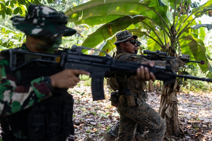 LAMPUNG, Indonesia (Sept. 7, 2026) — U.S. Marine Corps Sgt. Brandon Rivera, center, a squad leader with Alpha Company, 1st Battalion, 5th Marine Regiment, Marine Rotational Force – Darwin 26, a Republic of Korea marine with 3rd Reconnaissance Battalion, 6th Marine Brigade, and an Indonesian marine with 7th Infantry Battalion, 4th Infantry Brigade, assault through a position during jungle patrol training as part of Exercise Super Garuda Shield 26 near Lampung, Indonesia, Sept. 7, 2026. Super Garuda Shield is an annual exercise between the Indonesian National Armed Forces and U.S. Military designed to strengthen bilateral interoperability, capabilities, and cooperation. Rivera is a native of Texas. (U.S. Marine Corps photo by Sgt. Kyle Chan)