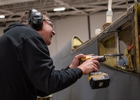 James Shobert performs programmed depot maintenance on a B-1 aircraft at the Oklahoma City Air Logistics Complex at Tinker Air Force Base, Oklahoma, Dec. 4, 2022. The B-1 is receiving upgrades outside of its depot maintenance schedule to enhance its lethality in the future. (U.S. Air Force photo by Carter Denton)