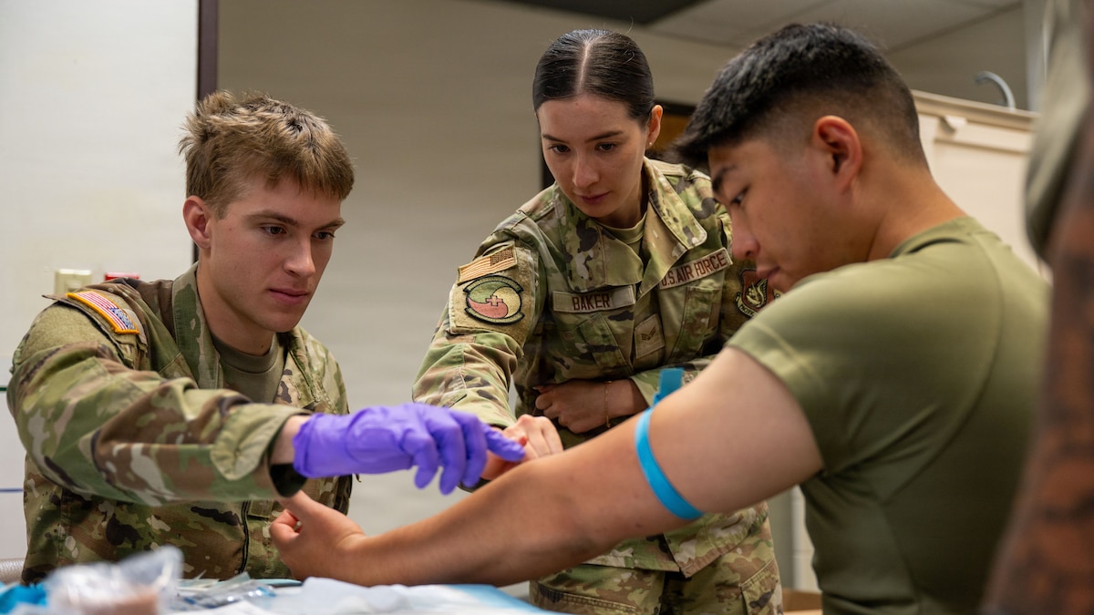 Medical personnel conduct training at Osan AB.