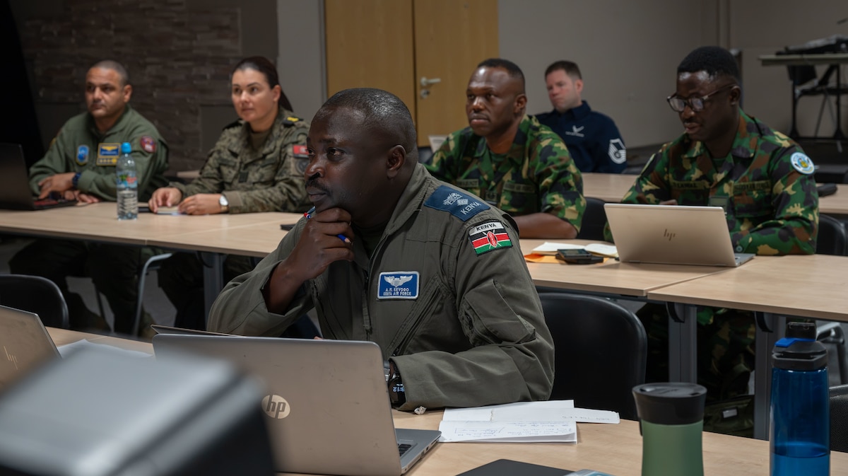 Members of the Association of African Air Forces from Kenya, Nigeria and Tunisia prepare for a discussion during the AAAF planning conference
