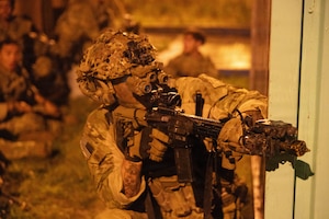 U.S. Soldier assigned to 173rd Mobile Brigade Combat Team (Airborne) scans for a simulated enemy during exercise Saber Junction 26 at Joint Multinational Readiness Center's Hohenfels Training area, Germany, September 05, 2026. 7th Army Training Command provides a unique environment in Europe to develop leaders and formations who are prepared for large-scale combat operations, improving readiness. (U.S. Army photo by Spc. Jordan Leroy)