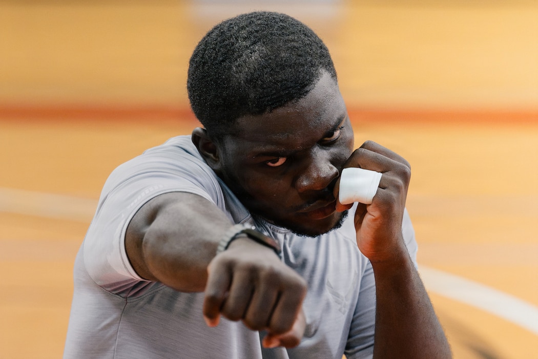 U.S. Air Force Airman 1st Class Mandela Sielatshom, a 52nd Operational Medical Readiness Squadron public health technician, participates in an introductory boxing class during Saber Fitness Day.