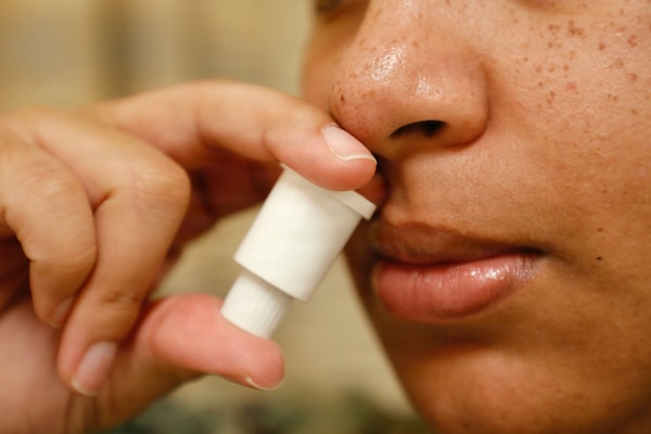 BETHESDA, Md. (Apr. 28, 2026) A sailor self-administers a dose of a nasal spray called INNA-051, designed to prevent and reduce symptoms of viral respiratory infections like the common cold or flu. The Naval Medical Research Command’s (NMRC) Clinical Trials Center (CTC) is preparing a study into the effectiveness of INNA-051, planned to begin in September. NMRC, headquarters of Navy Medicine Research & Development, is engaged in a broad spectrum of activity from basic science in the laboratory to field studies in austere and remote areas of the world to investigations in operational environments. In support of Navy, Marine Corps, and joint U.S. warfighter health, readiness and lethality, researchers study infectious diseases, biological warfare detection and defense, combat casualty care, environmental health concerns, aerospace and undersea medicine, operational mission support and epidemiology. (U.S. Navy photo by Tommy Lamkin /Released)