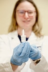 BETHESDA, Md. (Apr. 28, 2026) A researcher with Naval Medical Research Command’s (NMRC) Clinical Trials Center (CTC) holds a self-administered nasal spray called INNA-051, designed to prevent and reduce symptoms of viral respiratory infections like the common cold or flu. The CTC is preparing a study into the effectiveness of INNA-051, planned to begin in September. NMRC, headquarters of Navy Medicine Research & Development, is engaged in a broad spectrum of activity from basic science in the laboratory to field studies in austere and remote areas of the world to investigations in operational environments. In support of Navy, Marine Corps, and joint U.S. warfighter health, readiness and lethality, researchers study infectious diseases, biological warfare detection and defense, combat casualty care, environmental health concerns, aerospace and undersea medicine, operational mission support and epidemiology. (U.S. Navy photo by Sidney Hinds /Released)