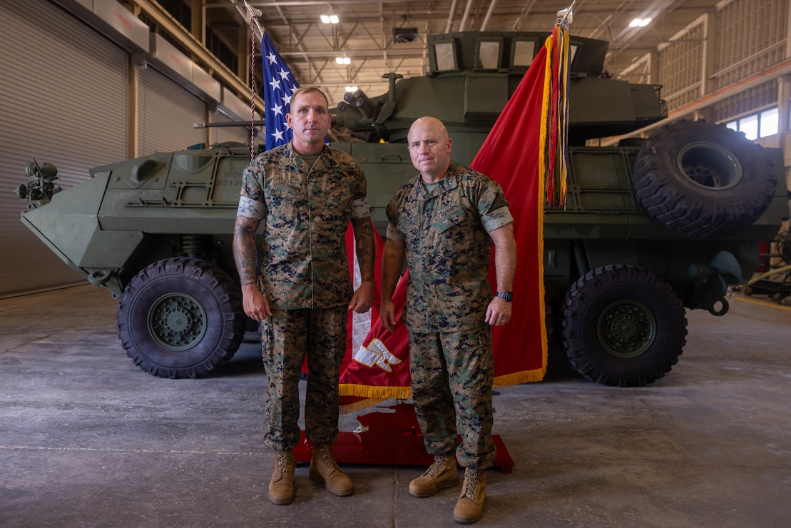 U.S. Marine Corps Maj. Gen. Farrell J. Sullivan, right, the commanding general of 2nd Marine Division, poses for a photo with Sgt. Maj. David K. McFadden, the outgoing command senior enlisted leader 2nd Light Armored Reconnaissance Battalion, 2nd Marine Division, during a relief and appointment ceremony at Marine Corps Base Camp Lejeune, North Carolina, Sep. 4, 2026. The ceremony transferred the duties and responsibilities of command senior enlisted leader from Sgt. Maj. David K. McFadden to Sgt. Maj. Jacob H. Olson. (U.S. Marine Corps photo by Lance Cpl. Preston Morris)