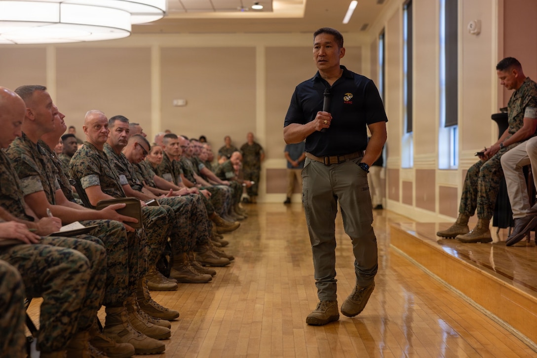 The Honorable Hung Cao, acting secretary of the Navy, speaks to Marines and Sailors during a suicide awareness and troop welfare town hall at Marine Corps Base Camp Lejeune, North Carolina, Sept. 2, 2026. The suicide awareness and prevention town hall reinforced the Marine Corps' commitment to troop preservation, wellness strategies, and fostering a command environment where seeking help is recognized as a fundamental element of mission readiness and the warfighting ethos. (U.S. Marine Corps photo by Sgt. DeMontae Stovall)