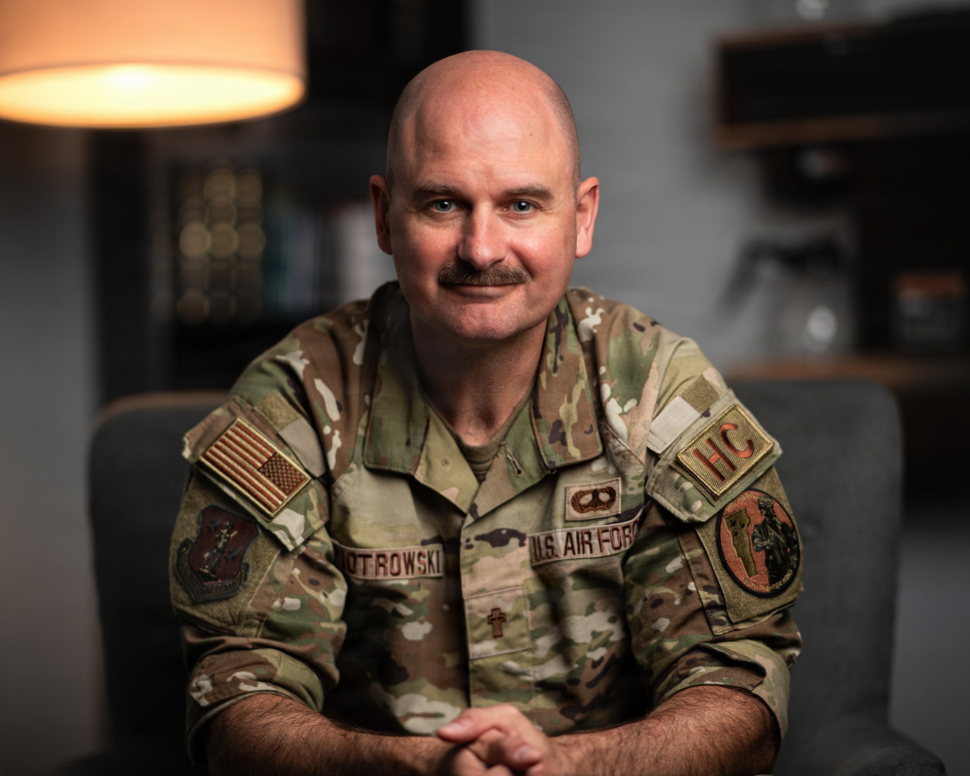 A photo of U.S. Air Force Capt. Nathan Piotrowski, a chaplain at the 158th Fighter Wing, sitting in his office in South Burlington, Vermont.