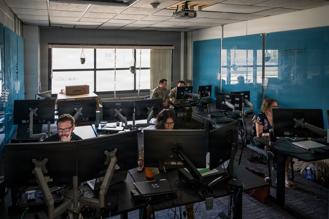 Guardians in uniform working at computers indoors