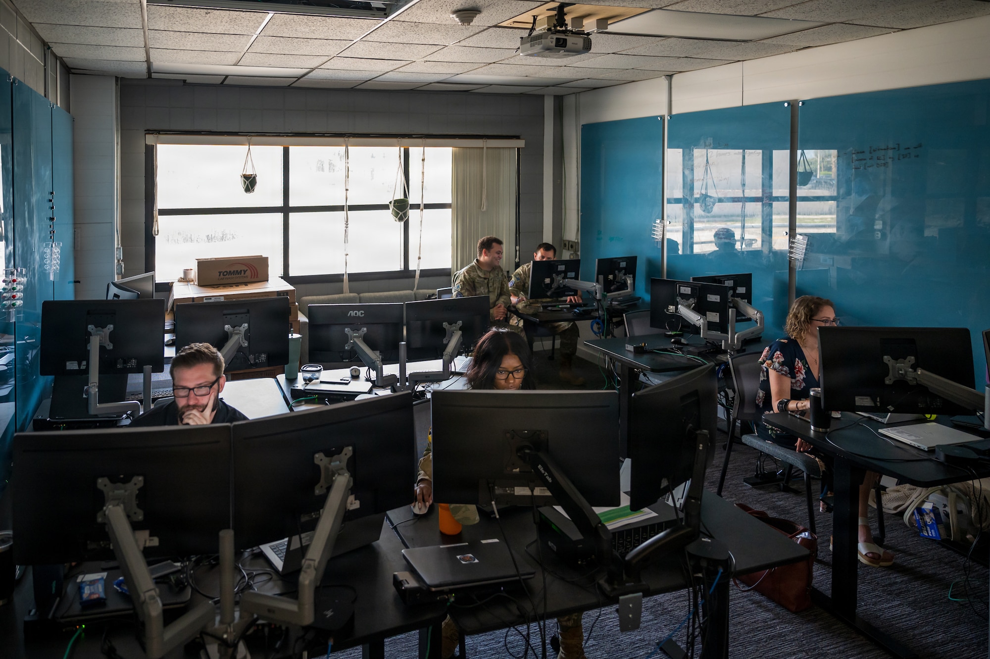 Guardians in uniform working at computers indoors