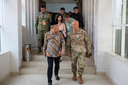 H. Asep Ismail, deputy regent of West Bandung, and U.S. Air Force Brig. Gen. Phillip L. Mallory, commander of the Hawaii Air National Guard, walk alongside one another during a meeting with West Java government officials as part of a humanitarian assistance and disaster relief engagement during Super Garuda Shield 2026 in Bandung, Indonesia, Sept. 3, 2026.