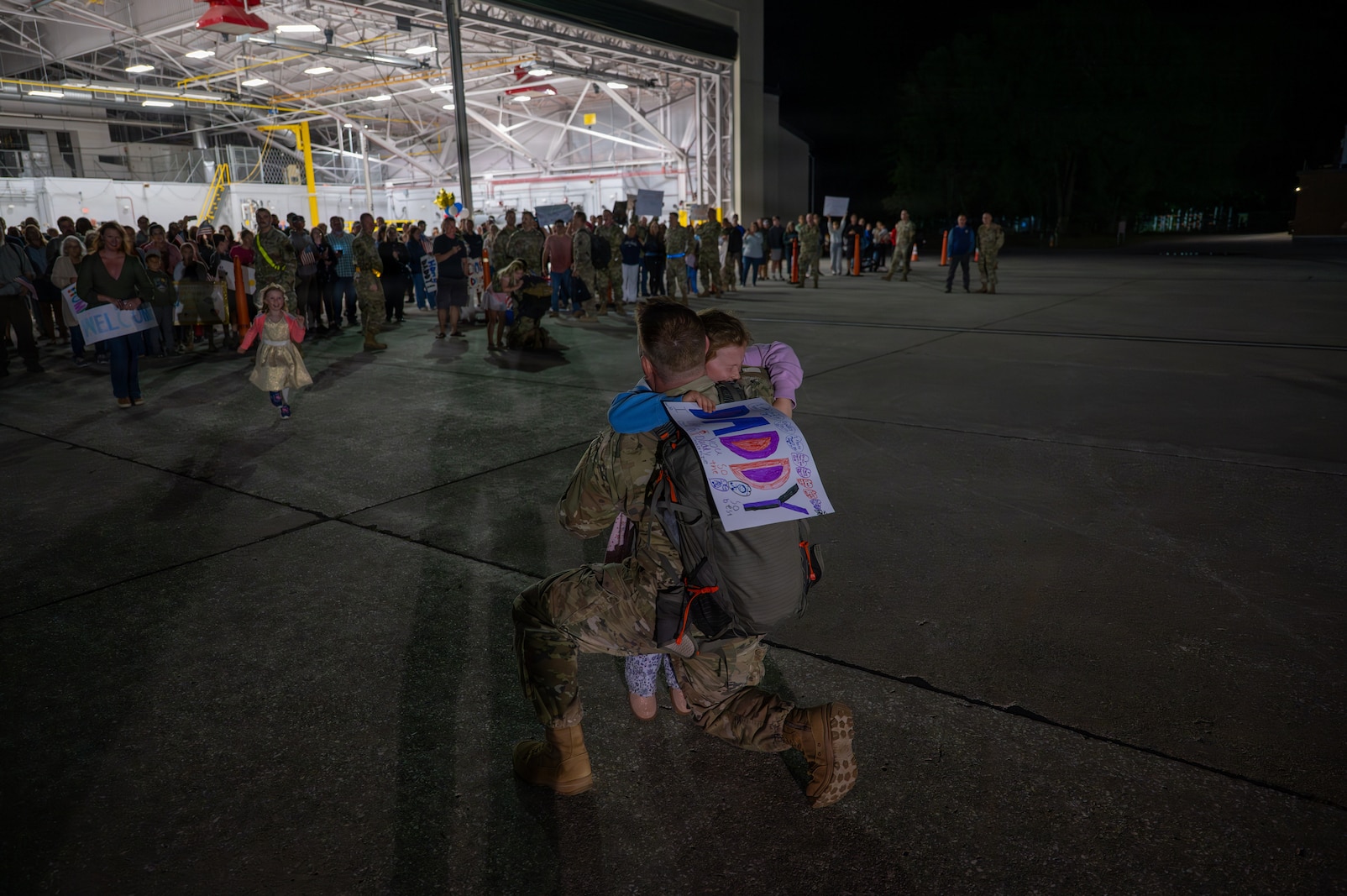 A photo of U.S. Air Force Airmen assigned to the 158th Fighter Wing returning from an overseas deployment, arriving back to the Vermont Air National Guard, South Burlington, VT.