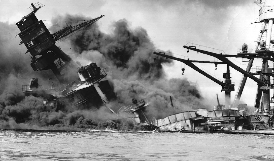 The USS Arizona (BB-39) burning after the Japanese attack on Pearl Harbor, December 7, 1941