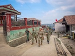 U.S. Air Force Brig. Gen. Phillip L. Mallory, commander of the Hawaii Air National Guard, and multinational service members walk through Pasirlangu Village in the mountainous Cisarua District near Bandung, Indonesia, Sept. 3, 2026, while conducting a site survey of an area affected by a January 2026 landslide. The survey was conducted as part of a humanitarian assistance and disaster relief engagement during Super Garuda Shield 2026. Super Garuda Shield is an annual exercise between the Indonesian National Armed Forces and U.S. military designed to strengthen bilateral interoperability, capabilities and cooperation. Photo by Tech. Sgt. Orlando Corpuz.