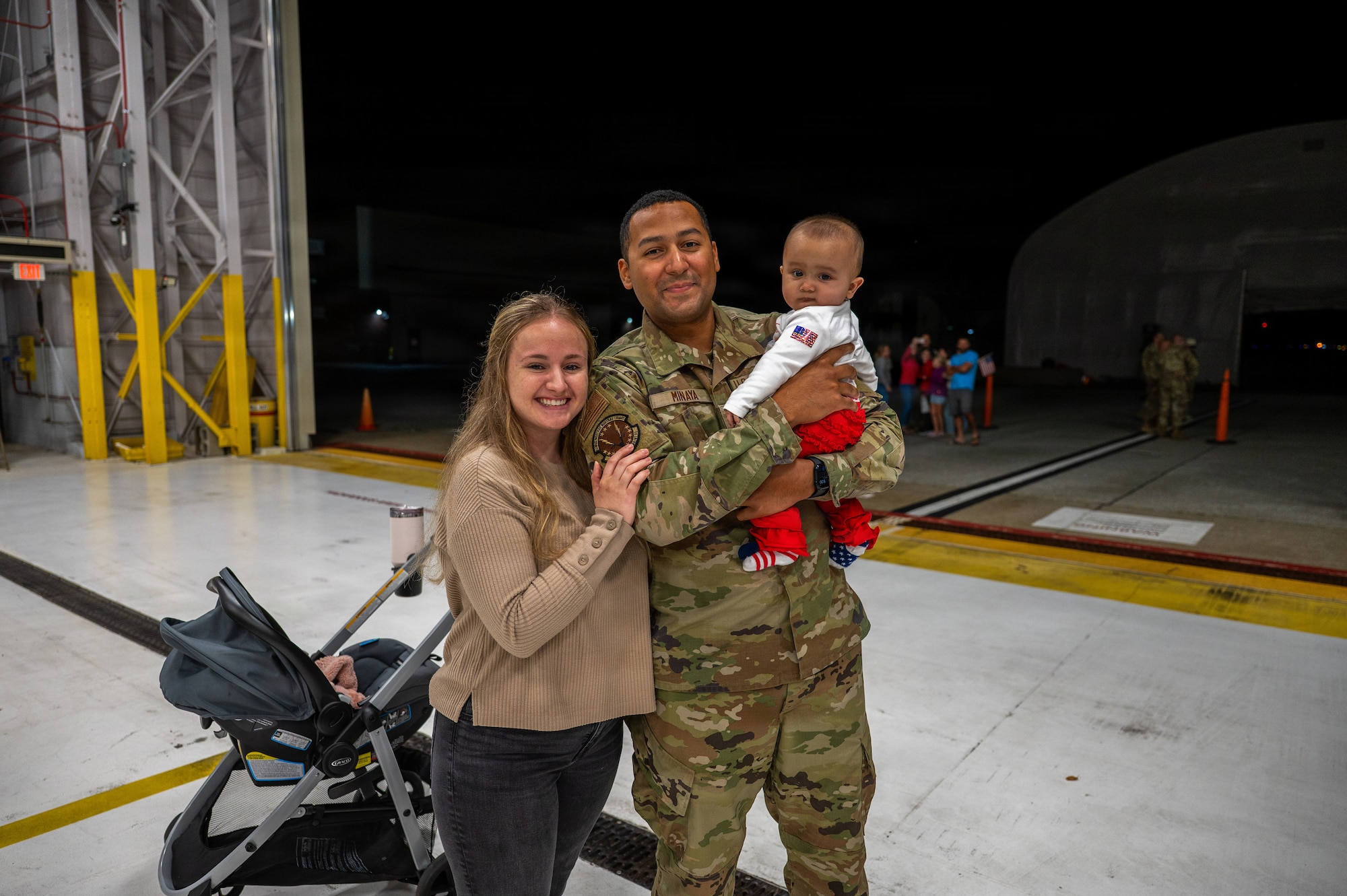 A photo of U.S. Air Force Airmen assigned to the 158th Fighter Wing return from an overseas deployment, arriving back to the Vermont Air National Guard, South Burlington.