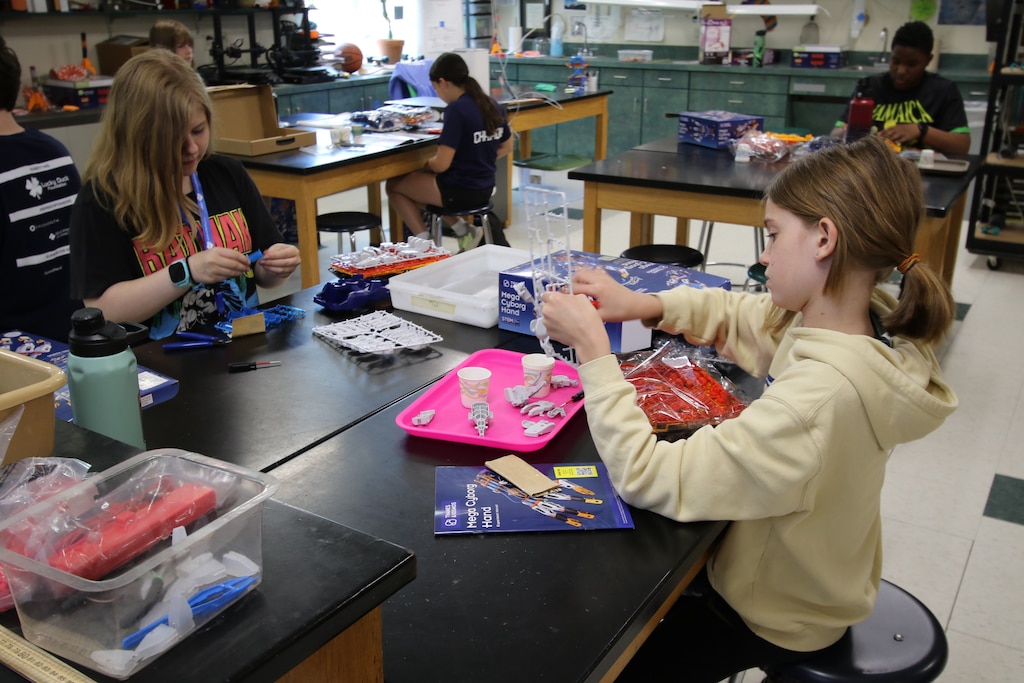 Several students engage in GEMS Camp activities at ERDC's Cold Regions Research and Engineering Lab, where they applied complex concepts to different experiments.