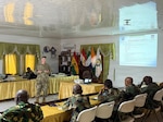 U.S. Air Force Lt. Col. David Hunter, assigned to the 110th Wing, Battle Creek Air National Guard Base, Michigan, discusses the status of discipline briefing with legal professionals from the Armed Forces of Liberia, Republic of Sierra Leone Armed Forces and Nigerian Armed Forces during an exchange of ideas involving maintaining good order and discipline within the armed forces, in Monrovia, Liberia, Sept. 1, 2026. The engagement focused on the administration of justice, due process, professional ethics and the rule of law, as part of the Department of War National Guard Bureau's State Partnership Program. Photo by 1st Lt. Michael Sian.