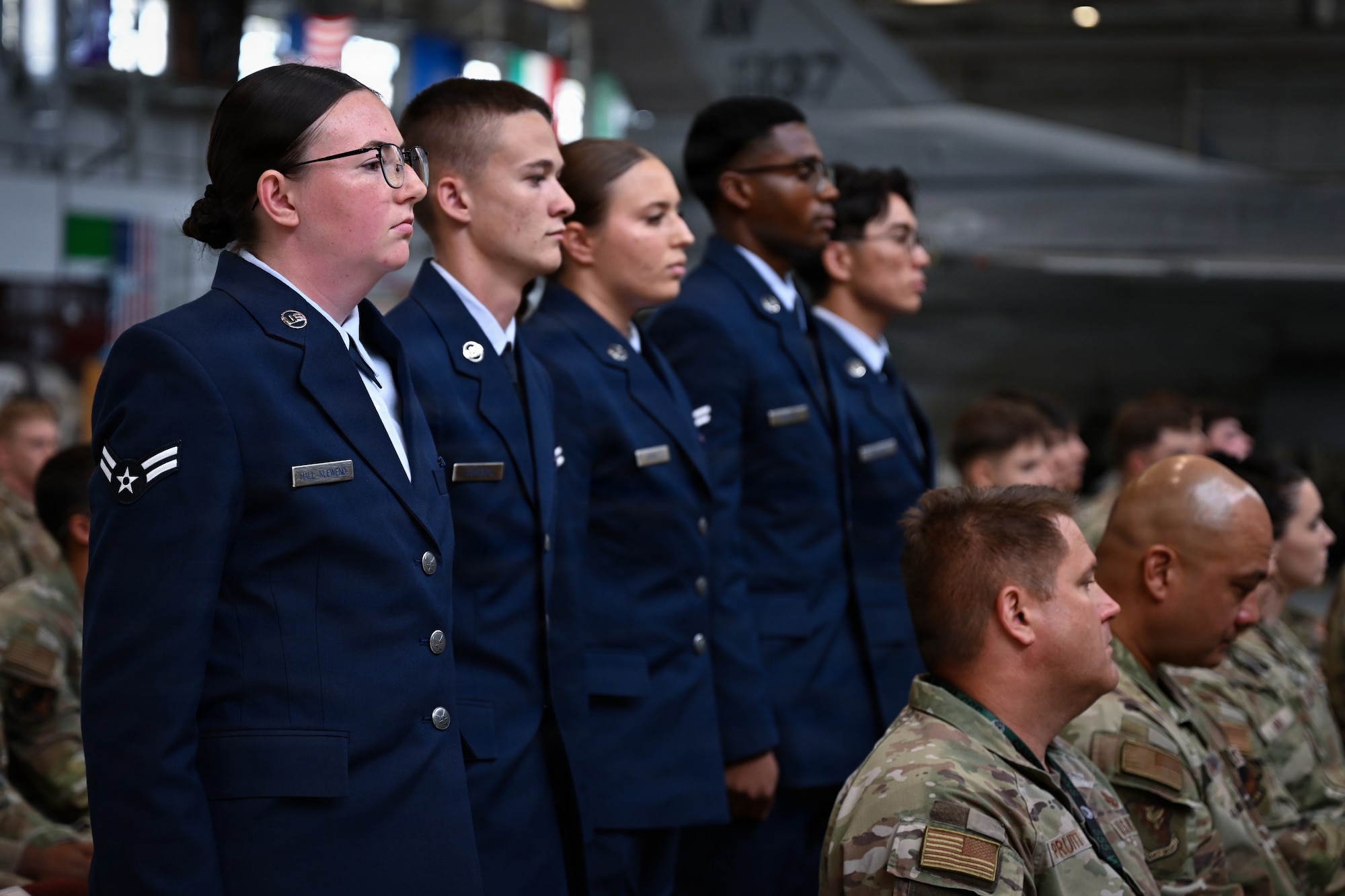 A group of Airmen stand together.
