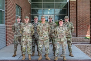 Kansas National Guard cyber specialists work alongside state and federal partners to monitor networks and analyze potential cyber threats during a state active duty mission in support of the FIFA World Cup at the Heartland Preparedness Center in Wichita, Kan. on July 15, 2026. The joint task force, consisting of Kansas Army and Air National Guardsmen, provides critical infrastructure defense, threat hunting, and incident response capabilities to ensure the security of state and local entities.(U.S. Air National Guard Photo by 1st Lt. Samantha Root)
