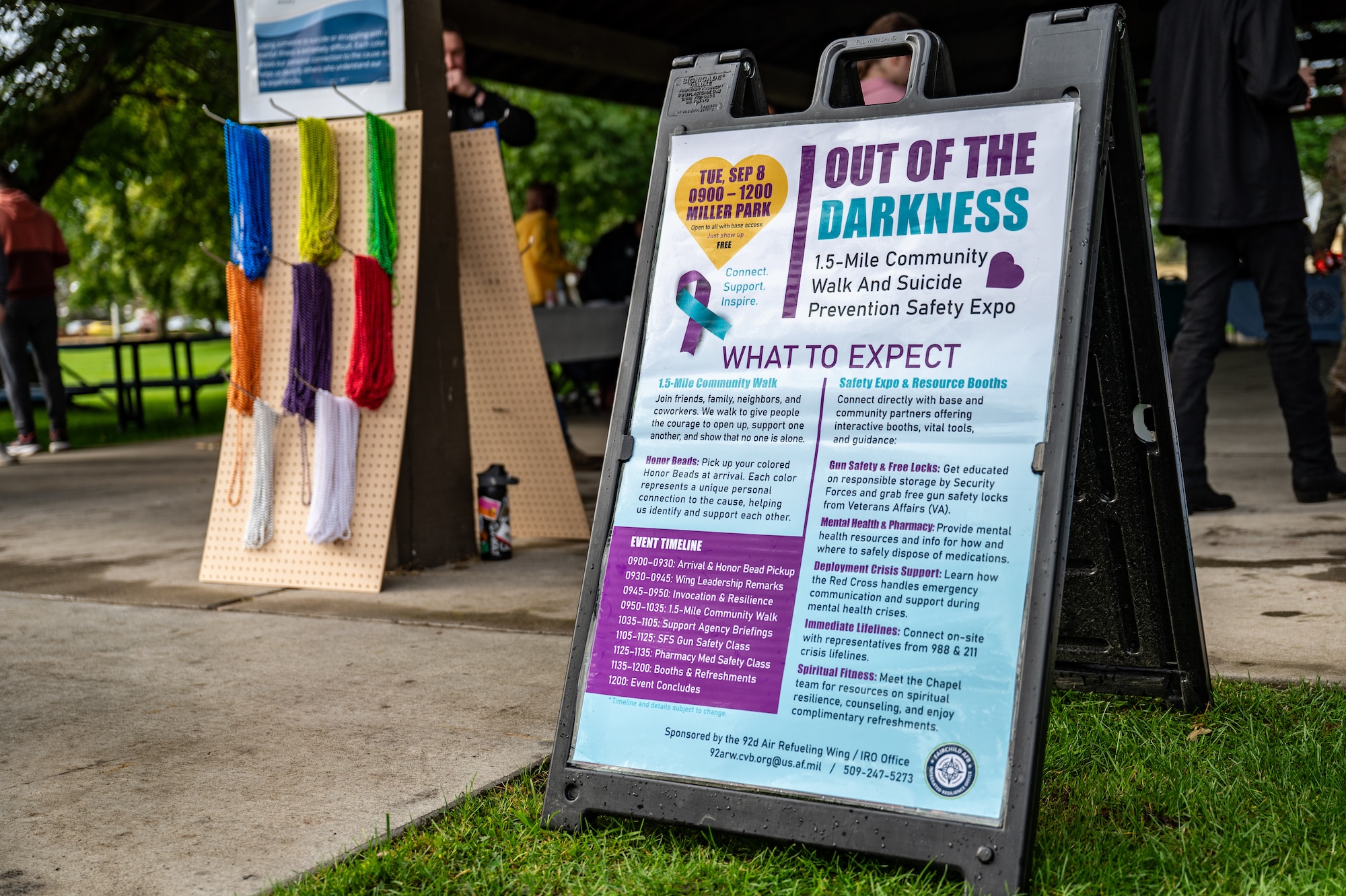 An Out of the Darkness event sign displays information about the one and a half mile walk and suicide prevention safety expo at Fairchild Air Force Base, Washington, Sept. 8, 2026.