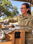 U.S. Army Capt. Genevieve Weldon, Army Service Lead for the Medical Education and Training Campus (METC) Nutrition and Diet Therapy course, supports Soldiers’ nutrition and readiness during a field training exercise. Capt. Weldon was recently awarded the 2026 Commission on Dietetic Registration Doctoral Scholarship through the Academy of Nutrition and Dietetics Foundation.