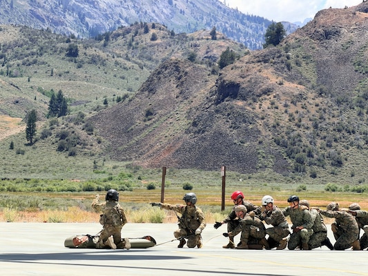 Corpsmen and U.S. and allied service members participate in air medical evacuation familiarization training at the Marine Corps Mountain Warfare Training Center in Bridgeport, California, July 15, 2026. The training provided participants hands-on experience with helicopter casualty loading and hoisting procedures in a high-altitude environment. (Courtesy photo).