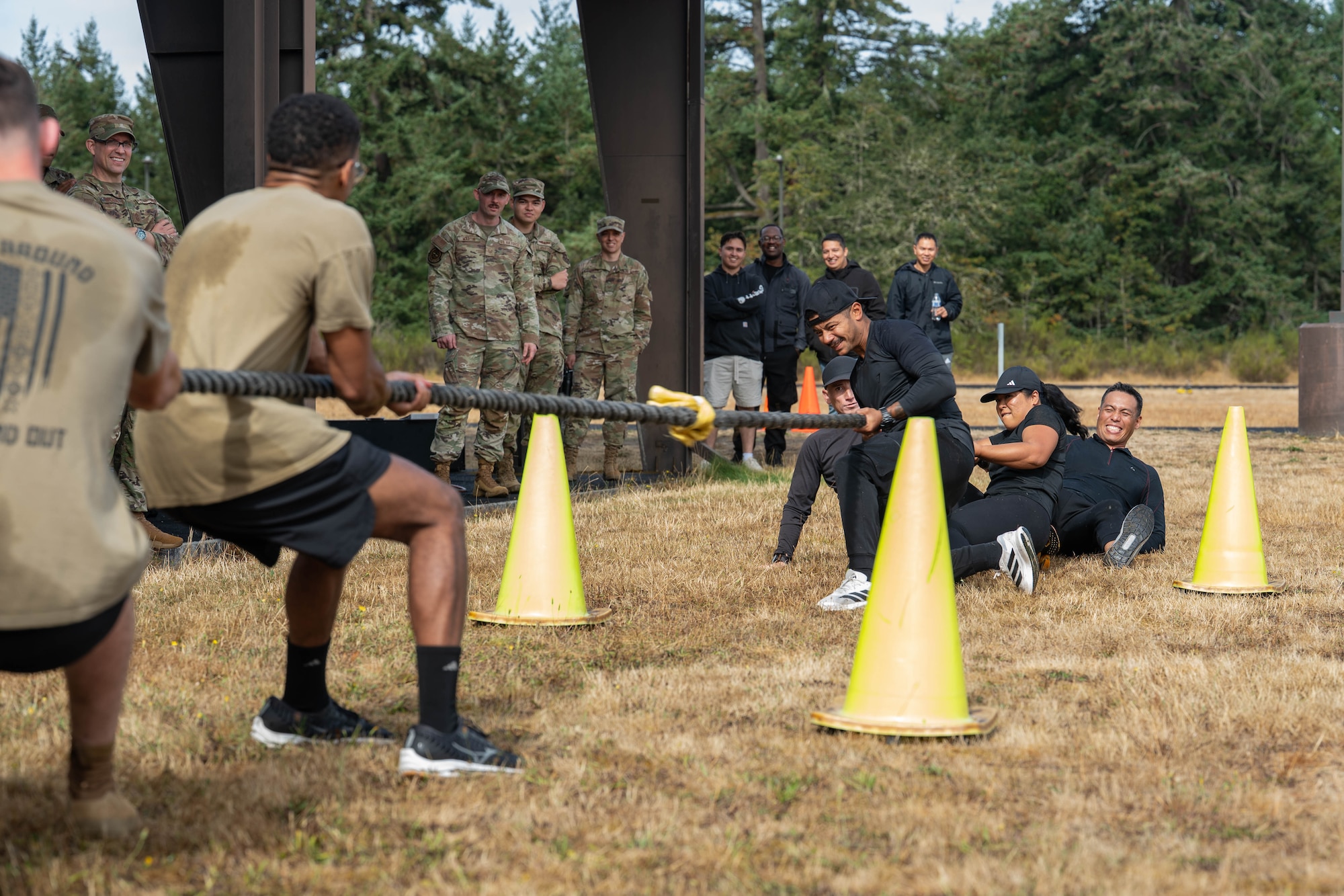Two groups participate in a tug-of-war match.