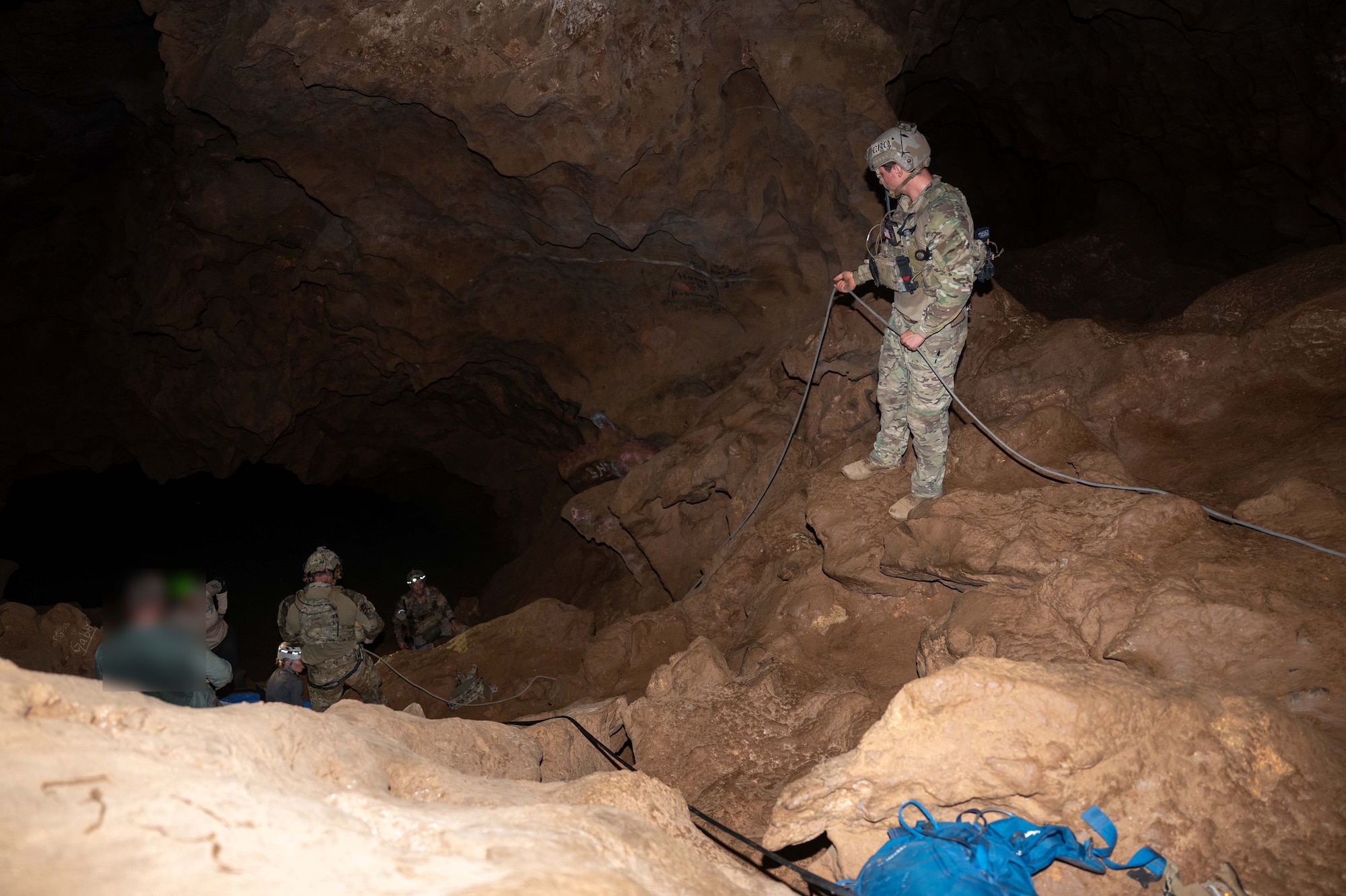 U.S> Air Force Pararescuemen assigned to the 68th Rescue Squadron perform a cave rescue during an exercise at a local cave, Arizona, August 20, 2026. The Pararescuemen participated in the Combat Leader Course, an intensive training event designed to teach Pararescuemen advanced rescue and leadership skills. (U.S. Air Force photo by Airman 1st Class Jaden Kidd)

Photo edited for security purposes.