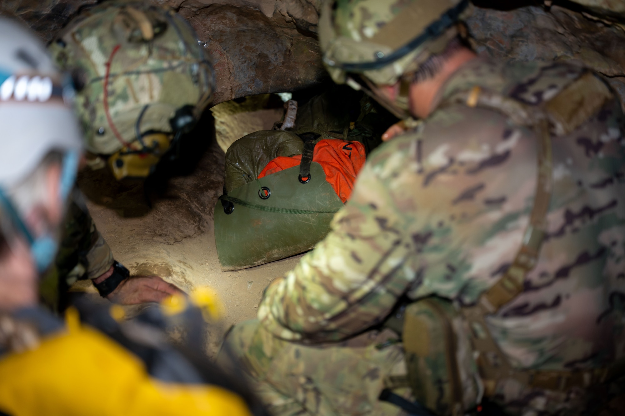 U.S. Air Force Pararescuemen assigned to the 68th Rescue Squadron transport a simulated casualty through a crawlway during an exercise at a local cave, Arizona, August 20, 2026. The training scenario tested the Pararescuemen’s rescue and response capabilities in an austere environment. (U.S. Air Force photo by Airman 1st Class Jaden Kidd)