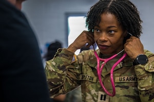 Capt. Templeton puts on her stethoscope.
