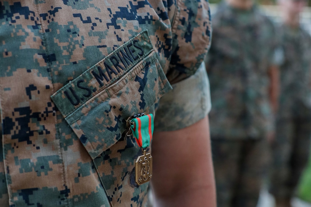 U.S. Marine Corps Cpl. Jeremiah Chancey, a White House sentry assigned to Guard Company, Marine Barracks Washington, stands at attention after receiving a Navy and Marine Corps Achievement Medal during an awards ceremony at Marine Barracks Washington, D.C., Sept 9, 2026. Col. Jason Copeland, commanding officer, Marine Barracks Washington, presented Navy and Marine Corps Achievement Medals to five Guard Company Marines for their professionalism, vigilance and resilience while serving as White House sentries during Operation Midnight Hammer and Operation Absolute Resolve from June 2025 to March 2026. Whether safeguarding the “Oldest Post of the Corps” or standing watch in direct support of the President, Barracks Marines demonstrate the discipline and resilience required to respond when and where they are needed. (U.S. Marine Corps photo by Capt. Lauri Schleicher)