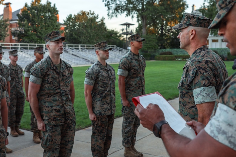 U.S. Marines who serve as White House sentries with Guard Company, Marine Barracks Washington, stand at attention during an awards ceremony at Marine Barracks Washington, D.C., Sept 9, 2026. Col. Jason Copeland, commanding officer, Marine Barracks Washington, presented Navy and Marine Corps Achievement Medals to five Guard Company Marines for their professionalism, vigilance and resilience while serving as White House sentries during Operation Midnight Hammer and Operation Absolute Resolve from June 2025 to March 2026. Whether safeguarding the “Oldest Post of the Corps” or standing watch in direct support of the President, Barracks Marines demonstrate the discipline and resilience required to respond when and where they are needed. (U.S. Marine Corps photo by Capt. Lauri Schleicher)