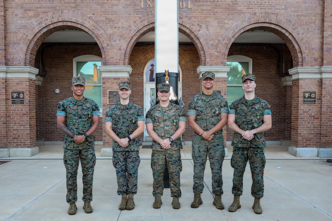 U.S. Marines who serve as White House sentries with Guard Company, Marine Barracks Washington, pose for a photo after receiving Navy and Marine Corps Achievement Medals during an awards ceremony at Marine Barracks Washington, D.C., Sept 9, 2026. Col. Jason Copeland, commanding officer, Marine Barracks Washington, presented Navy and Marine Corps Achievement Medals to five Guard Company Marines for their professionalism, vigilance and resilience while serving as White House sentries during Operation Midnight Hammer and Operation Absolute Resolve from June 2025 to March 2026. Whether safeguarding the “Oldest Post of the Corps” or standing watch in direct support of the President, Barracks Marines demonstrate the discipline and resilience required to respond when and where they are needed. (U.S. Marine Corps photo by Capt. Lauri Schleicher)