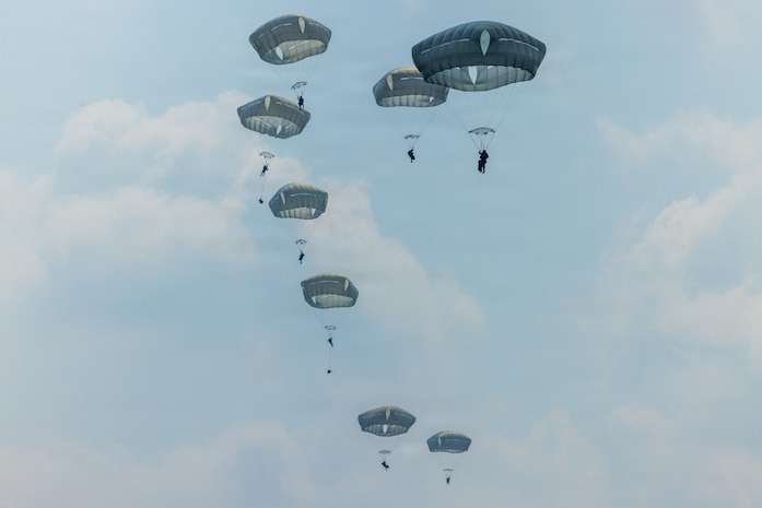 U.S. Soldiers assigned to 1st Battalion, 501st Parachute Infantry Regiment, 2nd Brigade Combat Team (Airborne), 11th Airborne Division, along with Indonesian, Indian, French, and Japanese service members, jump out of a C-130J Super Hercules aircraft during a multinational airborne jump as part of Super Garuda Shield 26 at Baturaja Combat Training Center, Indonesia, Sept. 4, 2026.