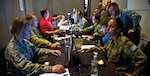 The Red Flag 14-1 cyber protection team works on defense procedures inside the Combined Air and Space Operations Center-Nellis during the exercise February 5, 2014, at Nellis Air Force Base, Nevada.