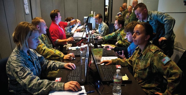 The Red Flag 14-1 cyber protection team works on defense procedures inside the Combined Air and Space Operations Center-Nellis during the exercise February 5, 2014, at Nellis Air Force Base, Nevada. The CPT’s primary goal is to find and thwart potential space, cyberspace, and missile threats against U.S. and allied forces. (U.S. Air Force photo/Senior Airman Brett Clashman)