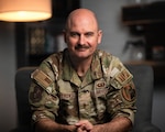 A photo of U.S. Air Force Capt. Nathan Piotrowski, a chaplain at the 158th Fighter Wing, sitting in his office in South Burlington, Vermont.