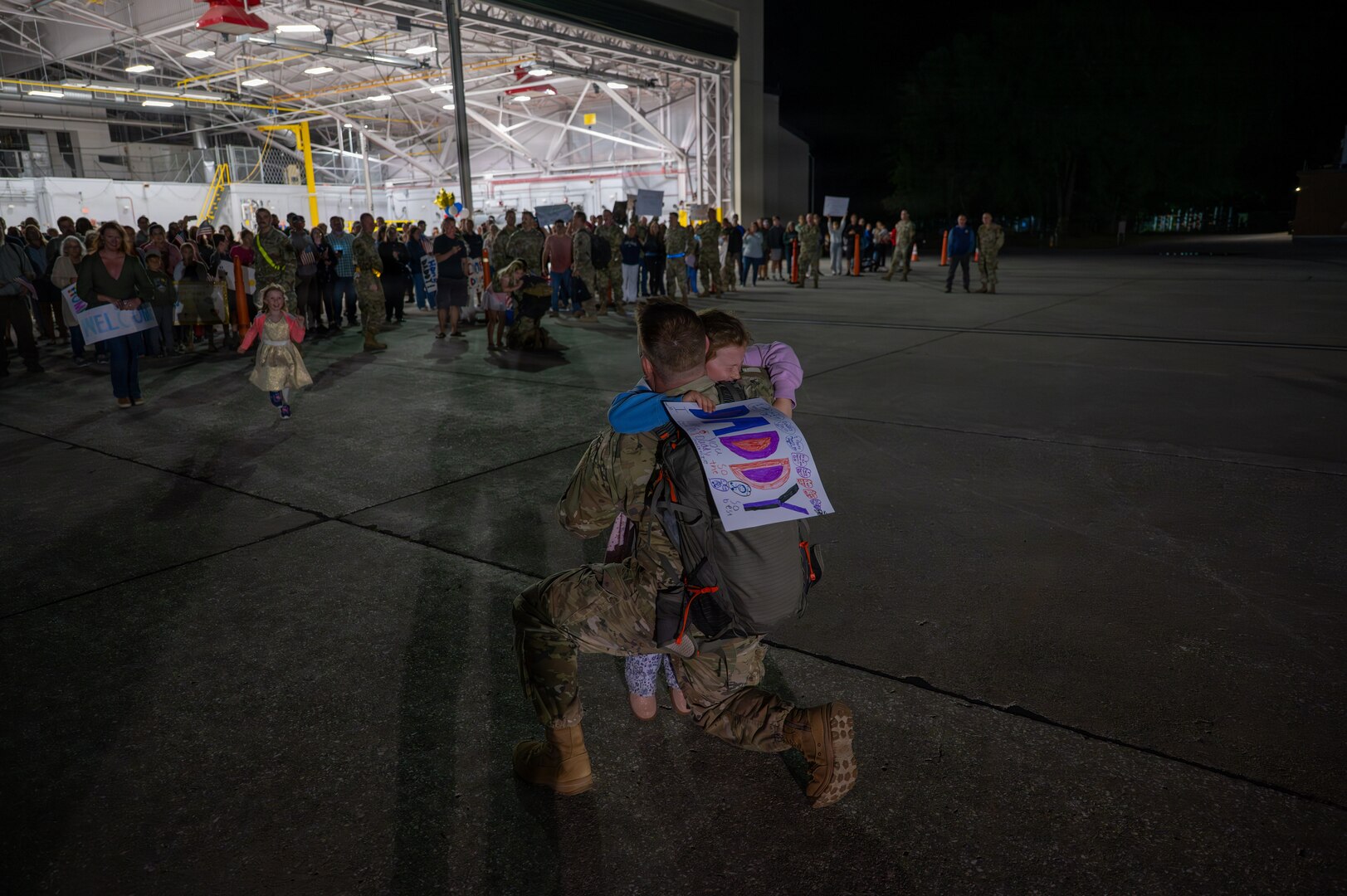 A photo of U.S. Air Force Airmen assigned to the 158th Fighter Wing returning from an overseas deployment, arriving back to the Vermont Air National Guard, South Burlington, VT.