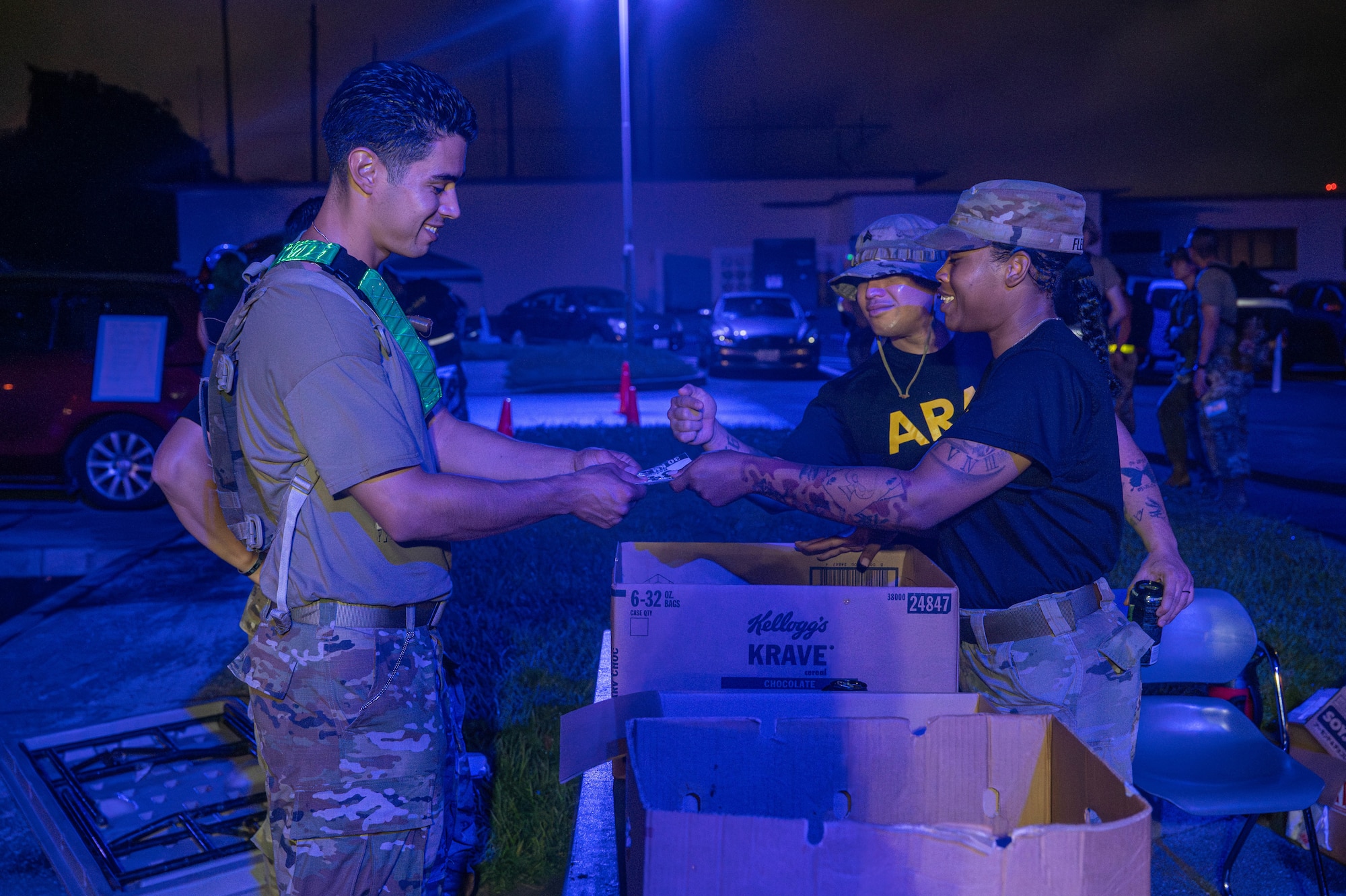 A U.S. Airman receives a number card before beginning the Royal Danish Air Force Flyver March at Kadena Air Base, Japan, Aug. 29, 2026. The Flyver March traces its roots to the Royal Danish Air Force and has become a military endurance event centered on completing a ruck march with a weighted pack. (U.S. Air Force photo by Airman 1st Class Nathaniel Jackson)