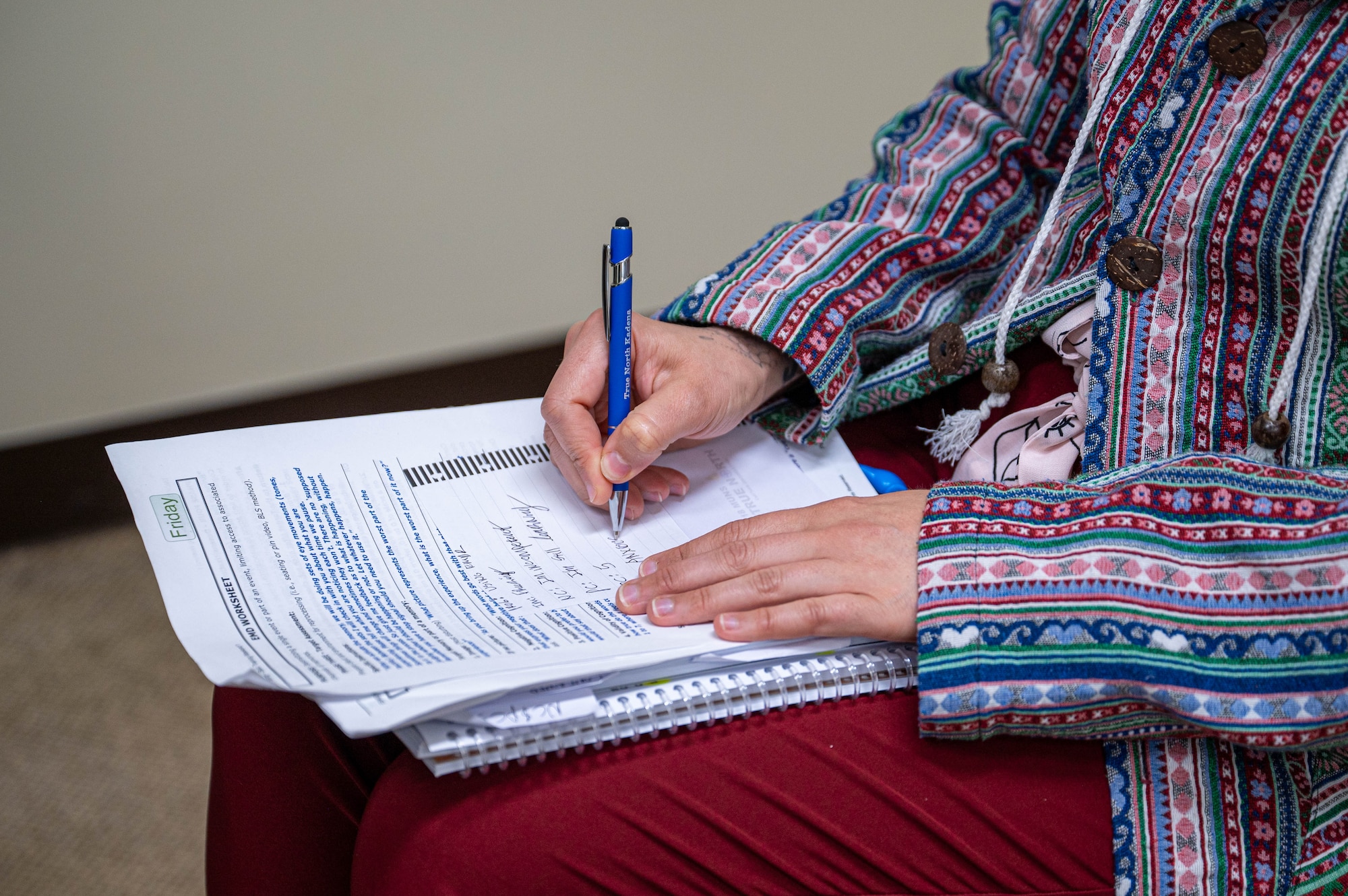A behavioral health provider takes notes while conducting eye movement desensitization and reprocessing training at Kadena Air Base, Japan, Aug. 21, 2026. Providers from across the Pacific attended the course to expand access to specialized, trauma-focused care throughout the region. (U.S. Air Force photo by Airman 1st Class Nathaniel Jackson)