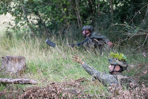 Kosovo Soldiers engage with U.S. Soldiers assigned to Joint Multinational Readiness Center's 1st Battalion, 4th Infantry Regiment, known as the opposition forces, at Hohenfels Training Area, during Saber Junction 26, Sep. 3, 2026. 7th Army Training Command provides a unique environment in Europe to develop leaders and formations who are prepared for large-scale combat operations, improving readiness. (U.S. Army photo by Cpl. Thomas Dixon)