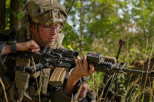 A U.S. Soldier assigned to Joint Multinational Readiness Center's 1st Battalion, 4th Infantry Regiment, known as the opposition forces, at Hohenfels Training Area, engages with the primary training audience during Saber Junction 26, Sep. 3, 2026. 7th Army Training Command provides a unique environment in Europe to develop leaders and formations who are prepared for large-scale combat operations, improving readiness. (U.S. Army photo by Pfc. Jermyiah Pangelinan)
