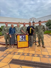 Members of U.S. Naval Hospital Rota’s Health Promotion and Wellness team display the Navy Surgeon General’s Health Promotion and Wellness Award in Rota, Spain, August 20, 2026. The command received the 2025 Blue H Award in recognition of its continued commitment to promoting health, wellness and operational readiness among staff members. (U.S. Navy photo by Lt. Cmdr. Alicia Sacks)