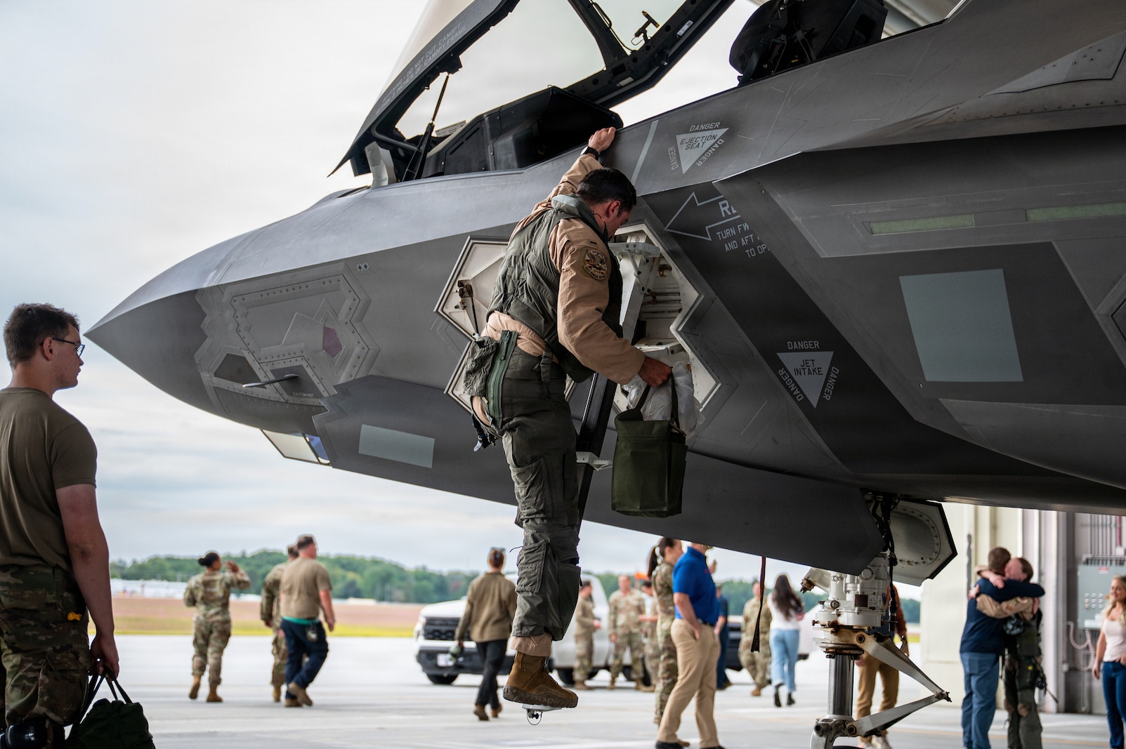 A photo of U.S. Air Force pilots and F-35A Lighting II aircraft assigned to the 158th Fighter Wing returning from an overseas deployment, arriving back to the Vermont Air National Guard, South Burlington, VT.