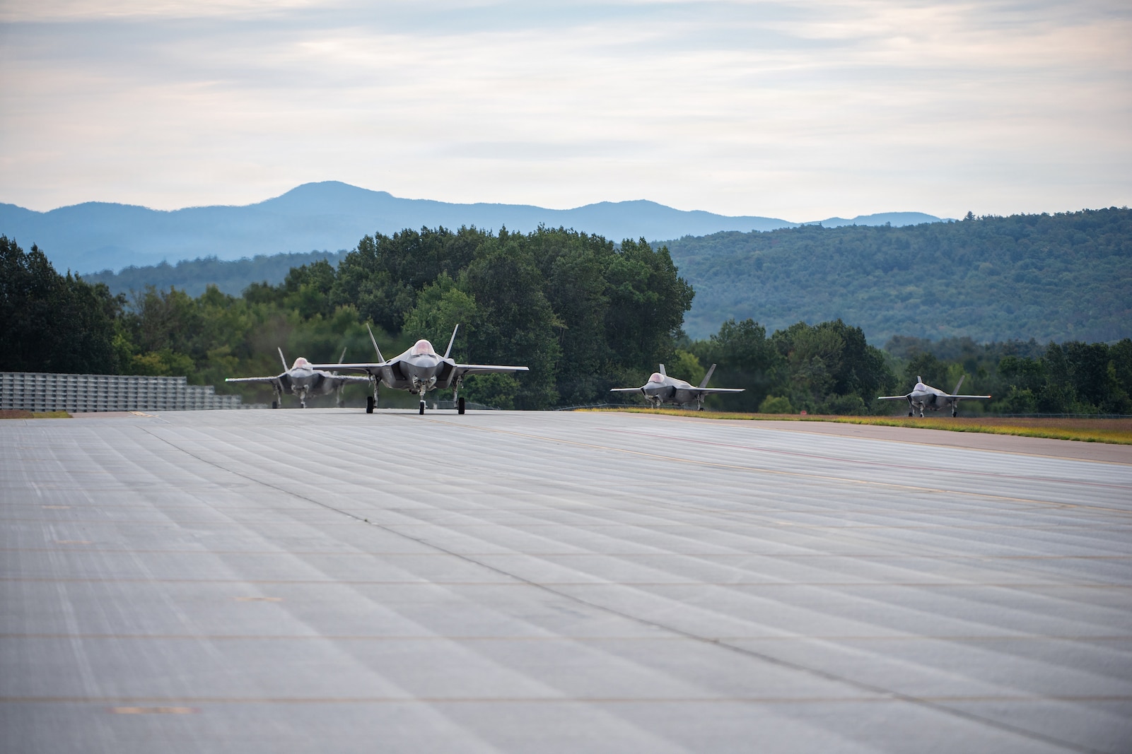 A photo of U.S. Air Force pilots and F-35A Lighting II aircraft assigned to the 158th Fighter Wing returning from an overseas deployment, arriving back to the Vermont Air National Guard, South Burlington, VT.