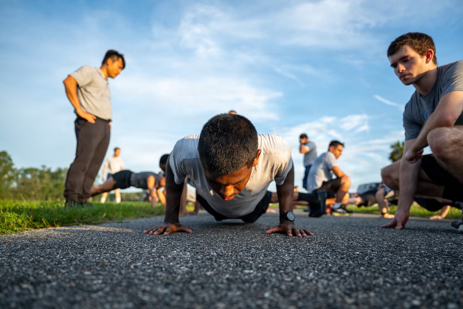 Student flight members assigned to the 125th Fighter Wing, Florida Air National Guard, perform pushups during a fitness assessment at Jacksonville Air National Guard Base, Florida, Aug. 16, 2026.