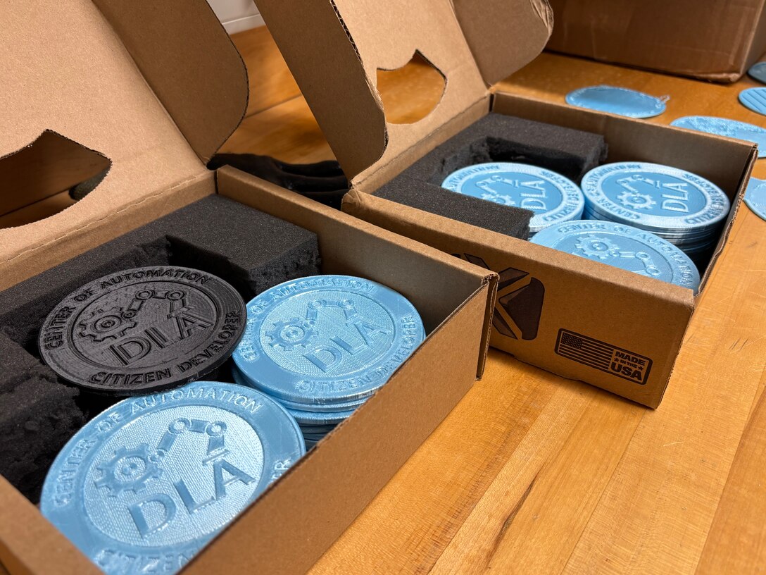 : Product Test Center Analytics engineers placed completed coasters in their boxes ready to ship from the lab in Philadelphia. The PTC lab created over 50 during their first batch of printing.