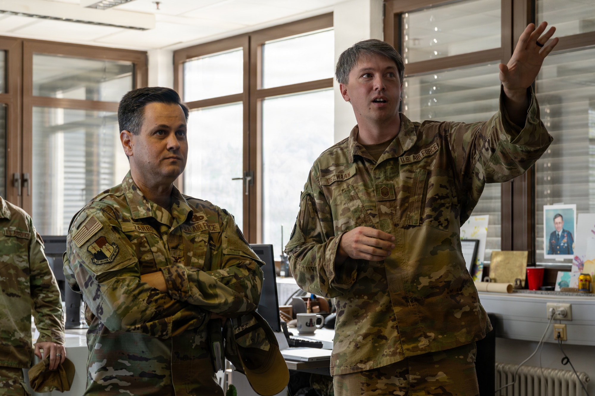Two U.S. Air Force Airmen speaking.