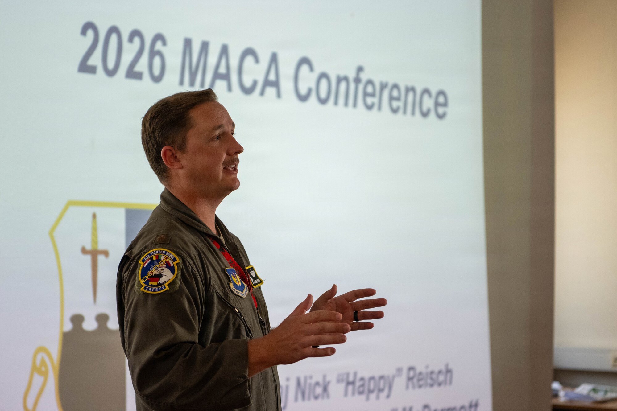U.S. Air Force Maj. Nick Reisch, a 52nd Fighter Wing safety officer, speaks during the 2026 Mid-Air Collision Avoidance (MACA) Conference.