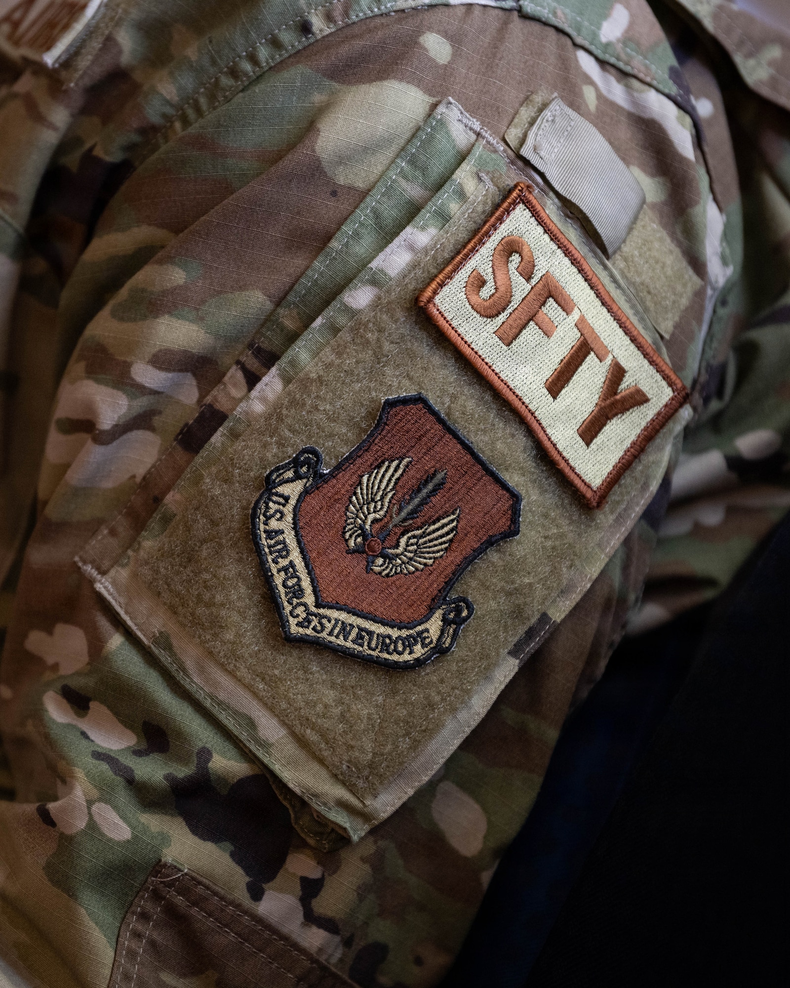 A safety duty identifier patch is displayed on a uniform.